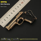 The 1:3 scale Beretta M92A1 held in hand to show the miniature tactical size.