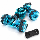 2-4ghz-4wd-gesture-sensing-rc-stunt-car-double-sided-led-toy: left-facing three-quarter studio hero with matching controller.