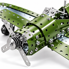 Close-up of the metal airplane model's silver nose propeller, green perforated brackets, and fasteners.