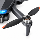 Close-up of the drone’s brushless motor pod and orange-tipped folding propeller.