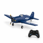 FX9503 F6F Hellcat RC fighter plane with its remote controller on a white studio floor