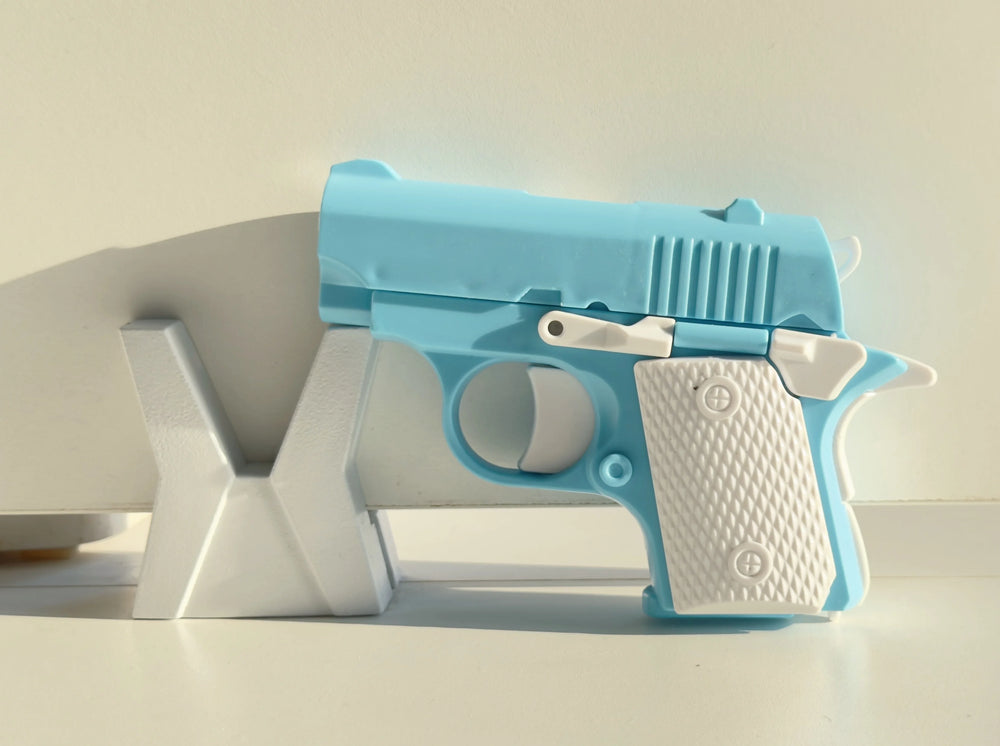 Toylvia Mini 1911 blue fidget toy gun displayed on white stand – ABS plastic stress relief toy.