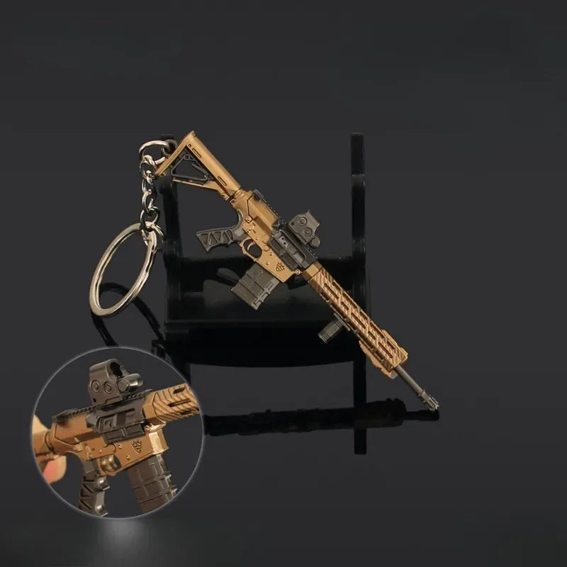 Mini M110 gold rifle keychain with close-up detail view on a dark background