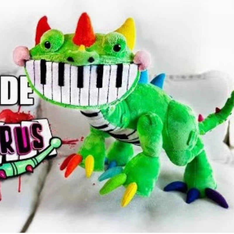 Close-up of green Pianosaurus plush toy with piano-teeth smile and colorful claws