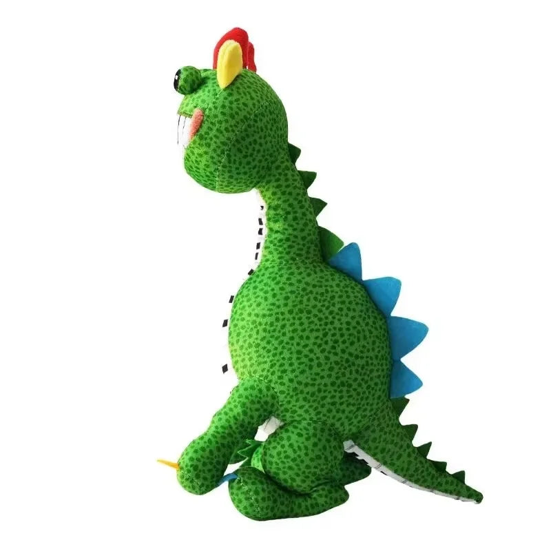Side view of green Pianosaurus plush toy with piano-teeth smile and blue back spikes
