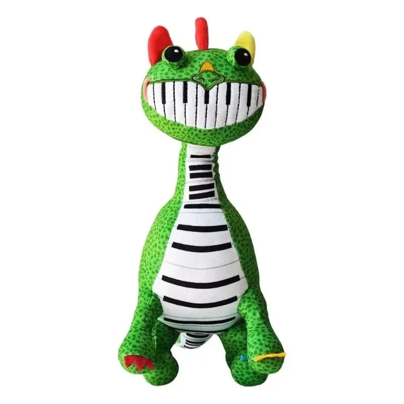 Standing green Pianosaurus plush doll with piano-teeth smile and colorful horns
