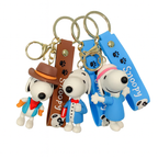 Set of three Snoopy character keychains with gold rings and colorful straps displayed on a white background.