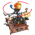Mechanical solar system 697PCS model showing full planetary rotation function with red arrows demonstrating movement.