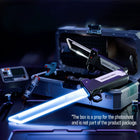 Two toy swords displayed beside an open prop case, with a glowing blue blade in front. Case not included.