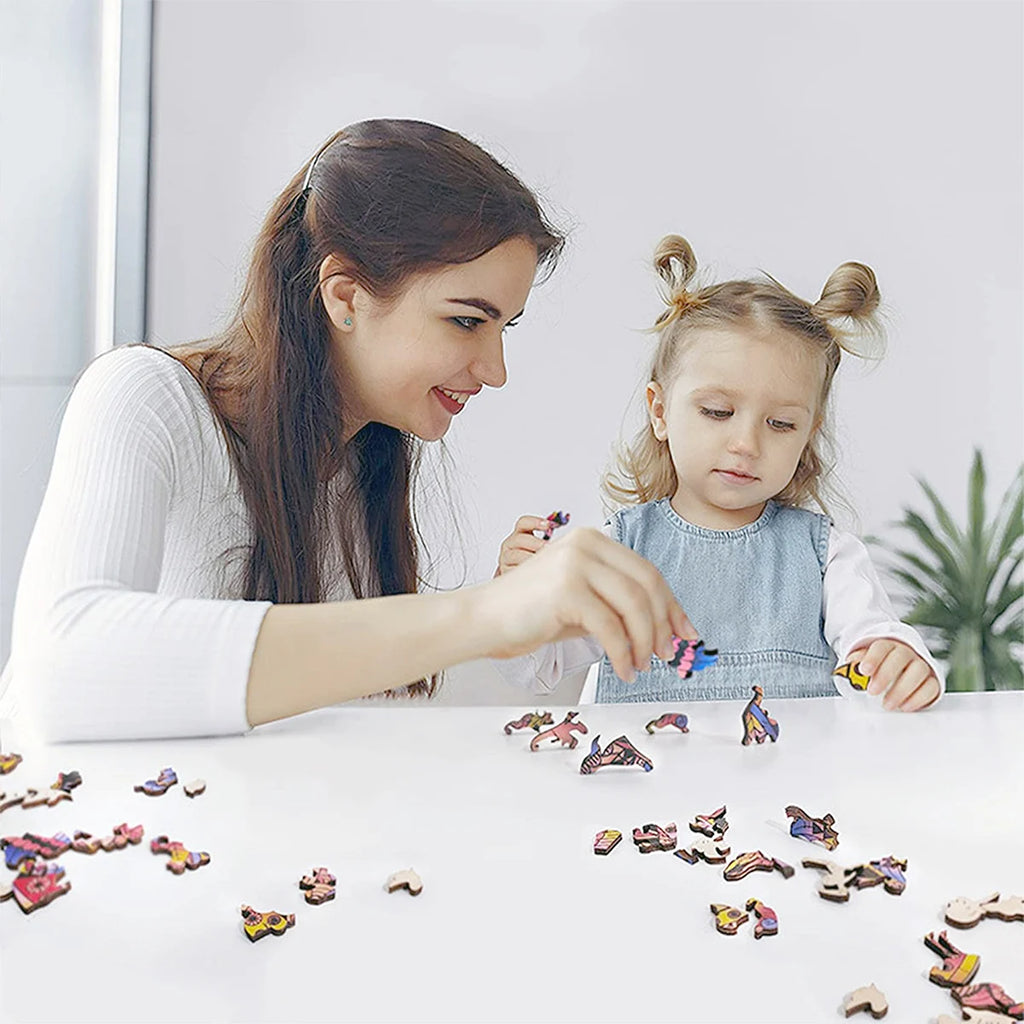 Adult and child playing with blue owl wooden jigsaw puzzle pieces together