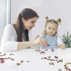 Adult and child playing with blue owl wooden jigsaw puzzle pieces together