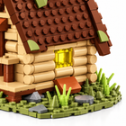 Close-up of the cabin wall, yellow window, brown roof and landscaped base.