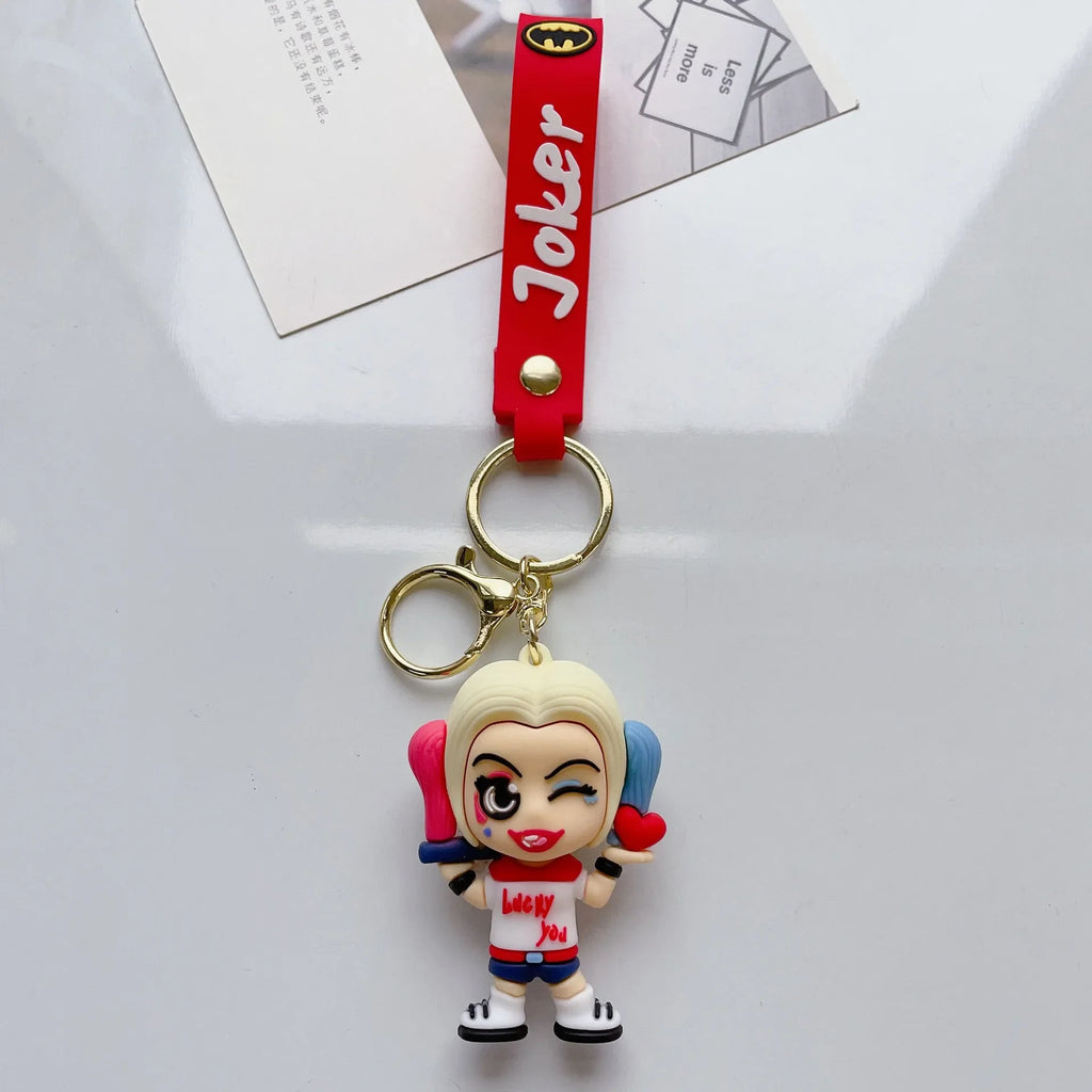 Single cartoon-style girl character PVC keychain with red strap on white background