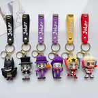 Set of cartoon-style villain and hero PVC keychains displayed on a white background