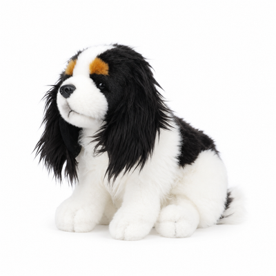 Left-facing Cavalier King Charles Spaniel plush toy on white background
