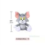 Plush toy of a cartoon character with measurement details on a white background