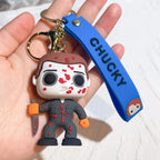Chucky-style horror doll keychain with bloody mask design and blue strap displayed in hand