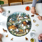 People working on a round puzzle with a forest design on a table.