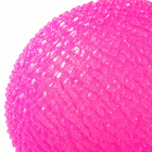 Close-up of the dense pink micro-bead texture on the crunchy stress ball