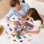 Adult and child assembling a cute mushroom cat wooden jigsaw puzzle with colorful irregular animal-shaped pieces.