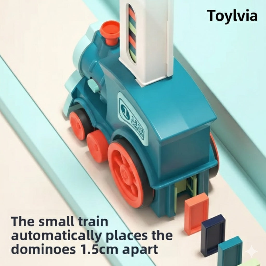 Top-down view of the small blue train automatically placing colorful dominoes exactly 1.5cm apart