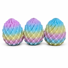 3pcs rainbow dragon egg fidget toy set of 3, centered on white with natural contact shadows