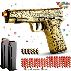 A premium gold-colored toy M1911 pistol featuring intricate floral and scrollwork engravings. The toy includes an orange safety tip, two magazines, several gold-colored shells, and numerous red soft-tip bullets. The branding "Toylvia Toys" and the slogan "Play • Learn • Grow" are displayed against a clean white background with colorful star and smiley face accents. Main image