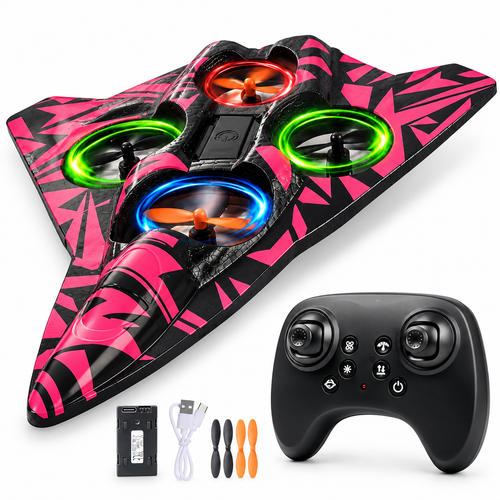 Pink and black EPP foam RC flying-wing airplane with matching black controller, battery, USB cable and spare propellers on white studio background.