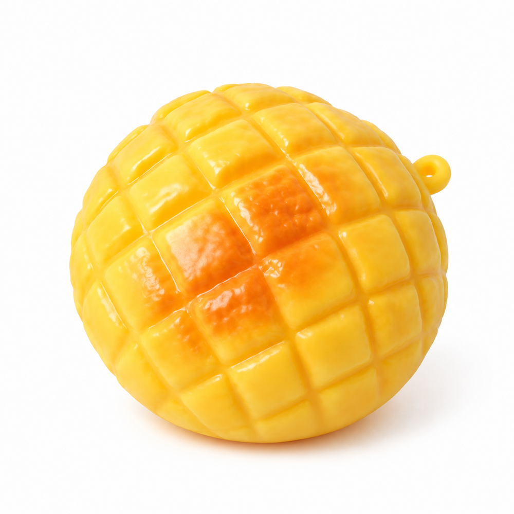 Yellow pineapple bun squishy toy on white, three-quarter view