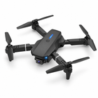 Three-quarter overhead view of the dark gray folding mini camera quadcopter.