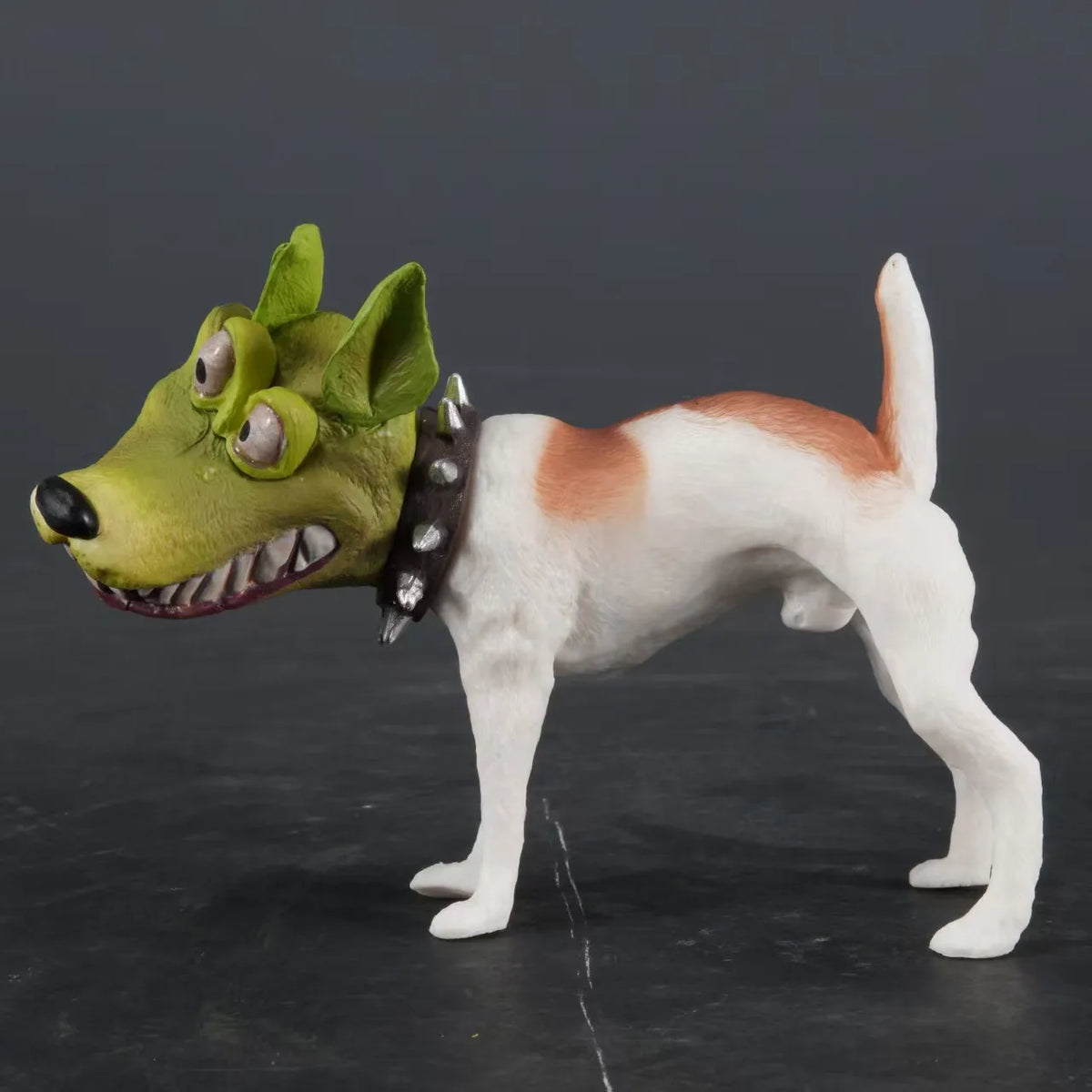Novelty dog figurine with a green cartoon face mask and exaggerated smile
