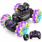 Gesture-sensing purple 4WD RC stunt car facing left with matching handheld remote and gesture watch.