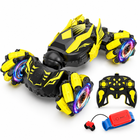 gesture-sensing-4wd-rc-stunt-car-360-drifts-dual-battery: left-facing three-quarter studio hero with matching controller.