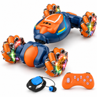 gesture-sensing-4wd-rc-stunt-car-twist-lights-music-kids: left-facing three-quarter studio hero with matching controller.
