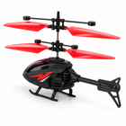 Red and black gesture-sensing RC helicopter shown from a three-quarter side angle.