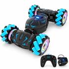 gesture-sensing-rc-stunt-car-interactive-3-modes-spray-kids: left-facing three-quarter studio hero with matching controller.
