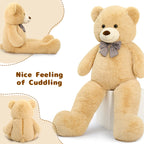 Beige teddy bear with a bow tie on a white background, labeled 'Nice Feeling of Cuddling'.