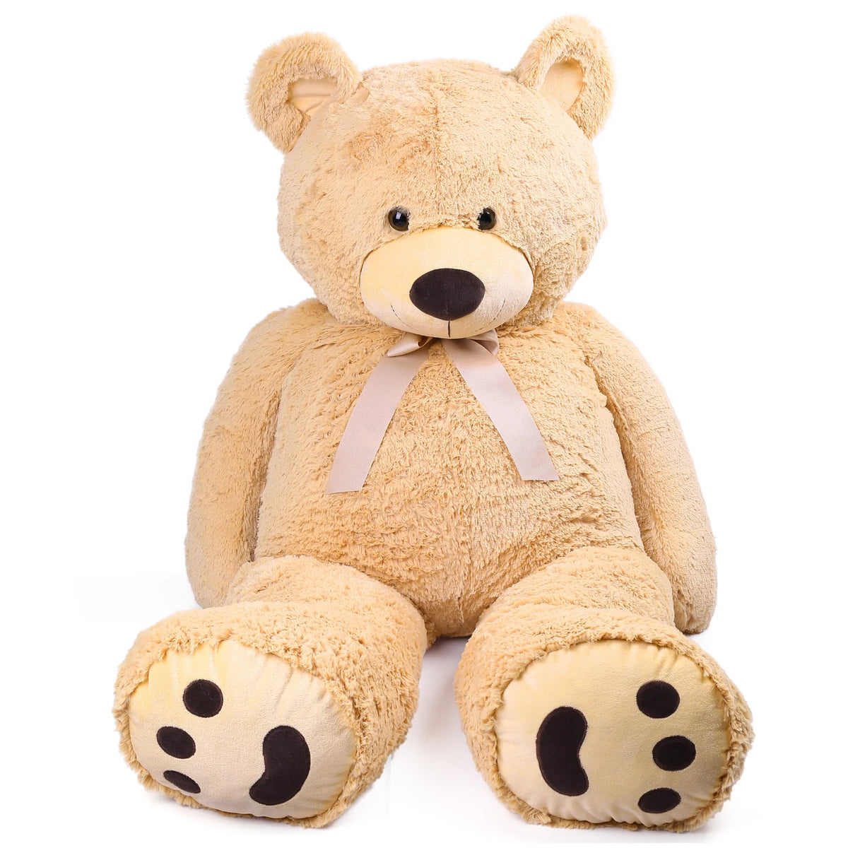 Beige teddy bear with a bow on a white background