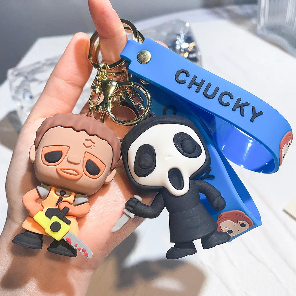 Masked horror doll and skull face cartoon keychains with blue strap, spooky collectible accessories