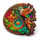 Three-quarter studio view of the assembled hummingbird wooden jigsaw puzzle showing its wood edge