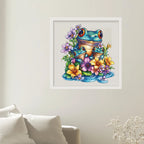 Framed artwork of a colorful frog surrounded by flowers on a wall.