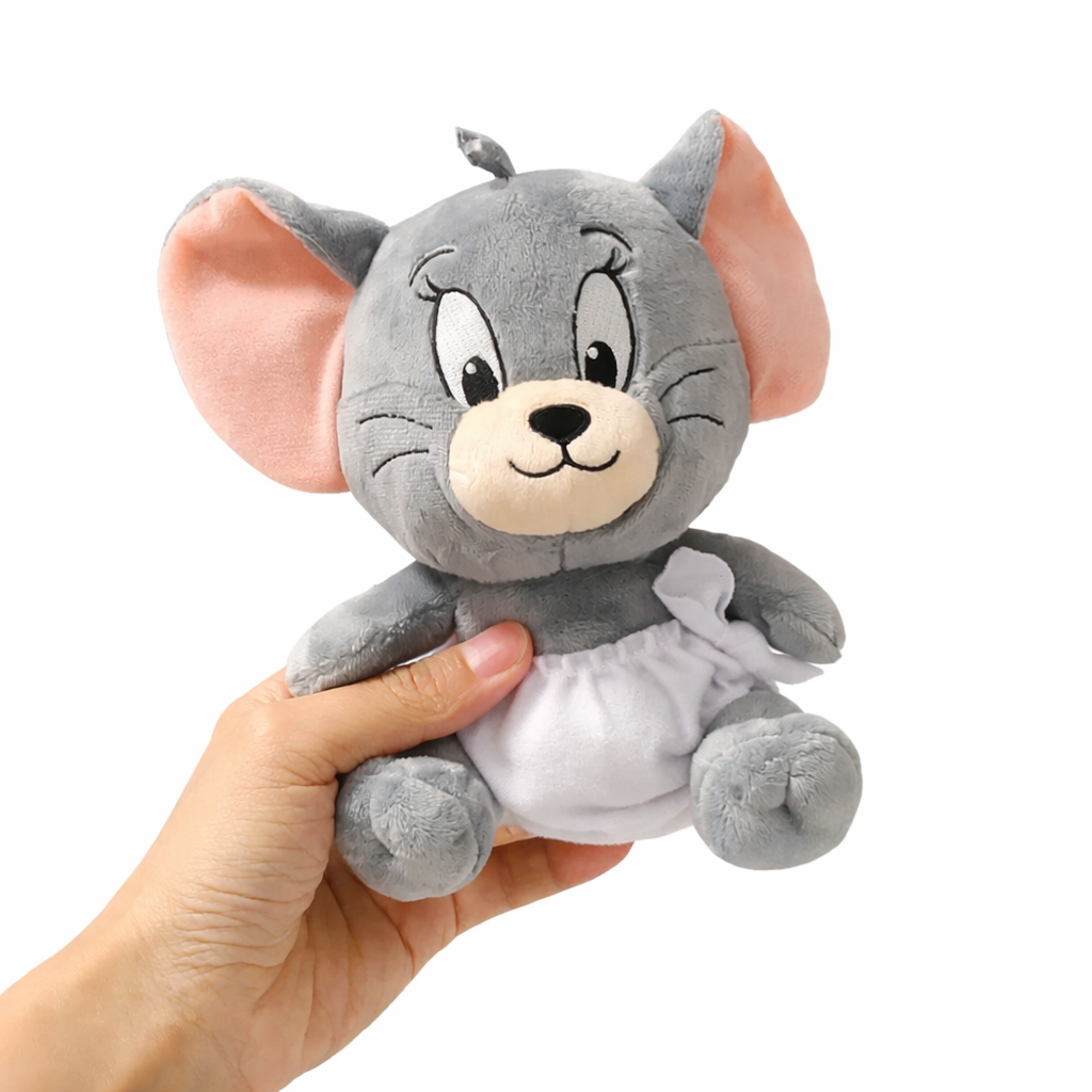 Jerry mouse plush toy from Tom and Jerry, soft gray stuffed animal with pink ears, photographed in hand on a clean white background