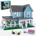 Toy house set with detailed exterior and furniture, including a box labeled 'BUILDITL'.