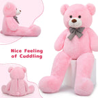 Pink teddy bear with a bow tie on a white background, with text 'Nice Feeling of Cuddling'.