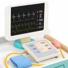 Close-up of the medical cart toy screen and blood-pressure play board.