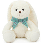 White teddy bear with a blue bow tie on a white background