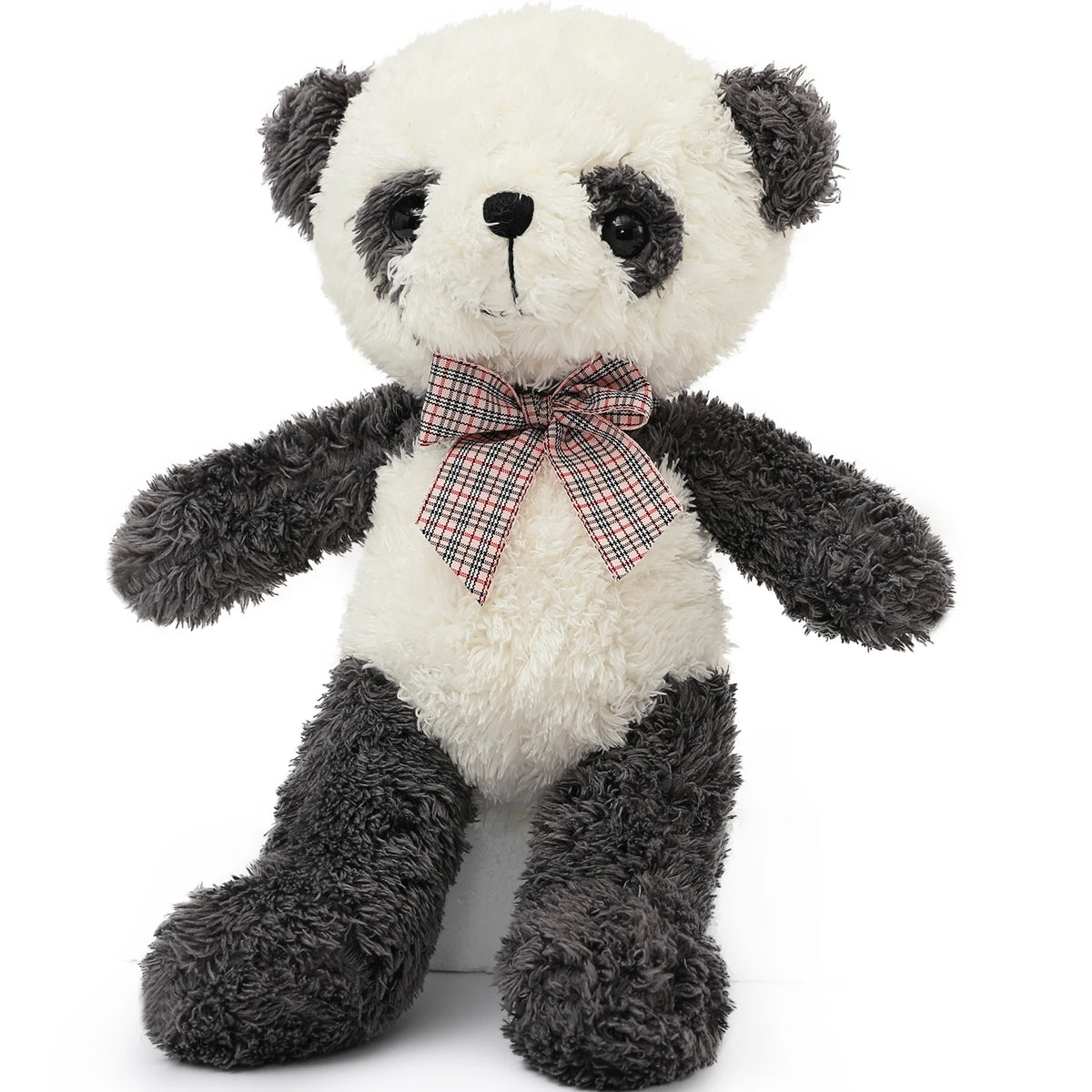 Plush panda bear with a red checkered bow tie on a white background