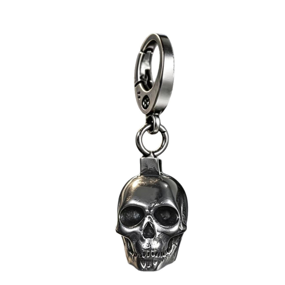 Men's solid stainless steel skull keychain pendant in silver standing on a clean white background.