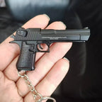 Metal 1:4 scale Desert Eagle style model keychain in black finish, alloy decorative collectible close-up