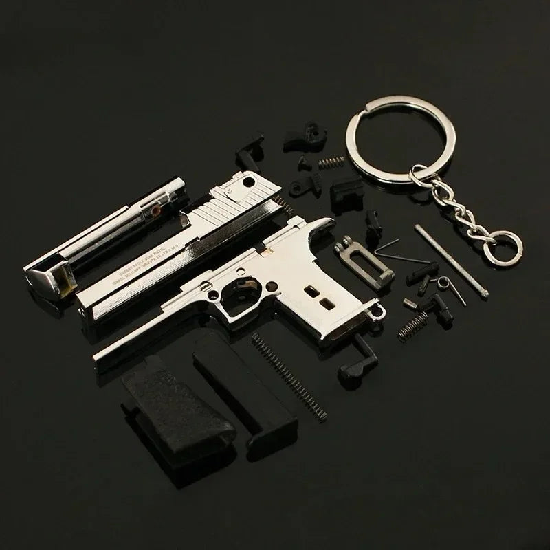 Metal 1:4 scale Desert Eagle style model keychain shown disassembled, alloy decorative collectible parts